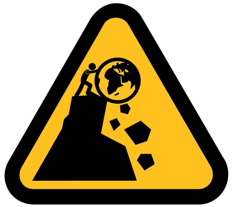 Warning sign, triangular on a yellow background, man busy pushing the planet Earth off the top of a mountain, rocks already falling