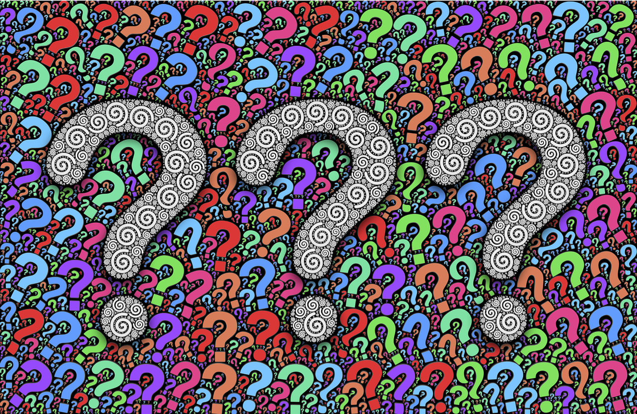 A graphic. Against a backdrop of many small colourful question marks, there are three large central black-and-white question marks. The effect is somewhat psychedelic.