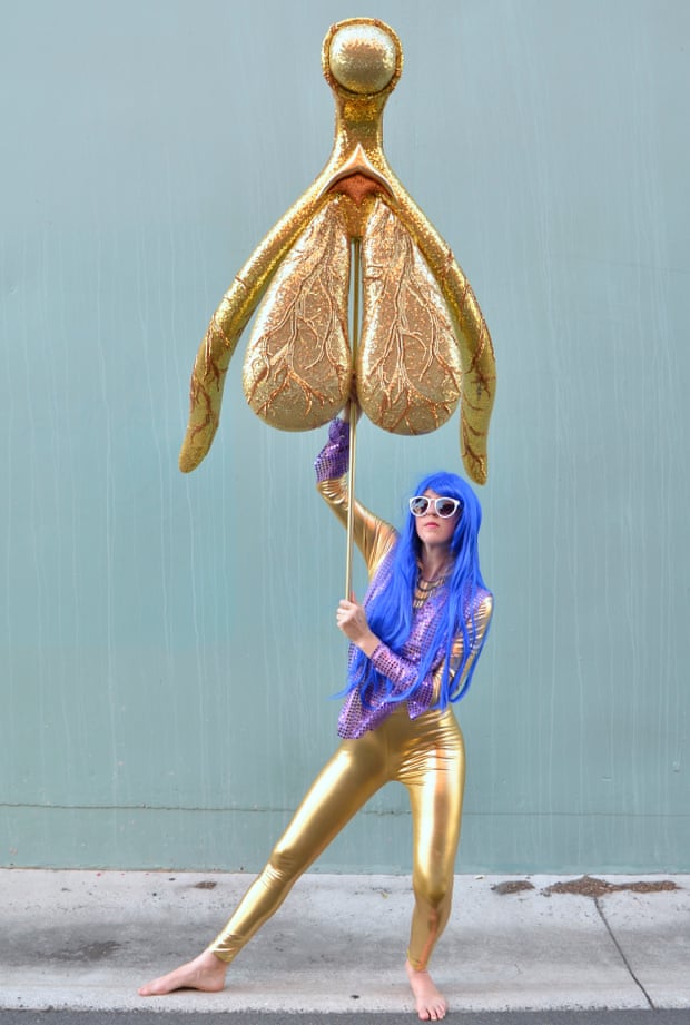 Glitoris held above Alli Sebastian Wolf's head
