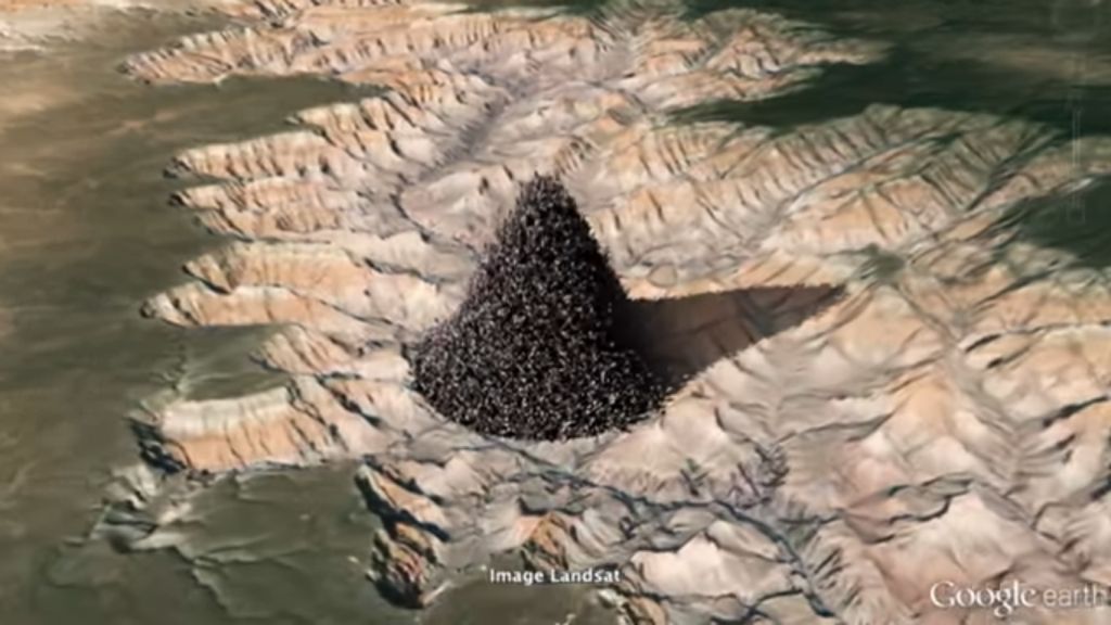7.2 billion humans in a pile in the vastness of the Grand Canyon (screenshot from Vsauce video 'How Many Things Are There?', ±23s)