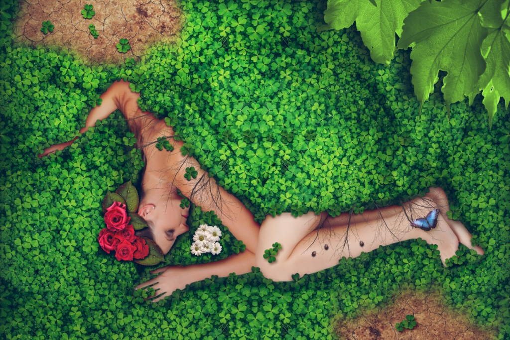 Mother Earth marginalised and asleep in foliage