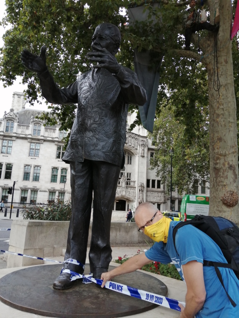 XR tree climber, Mandela statue, police line at Parliament Square London
