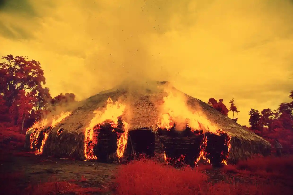 A yano - a Yanomami communal house - has been set on fire and is burning down