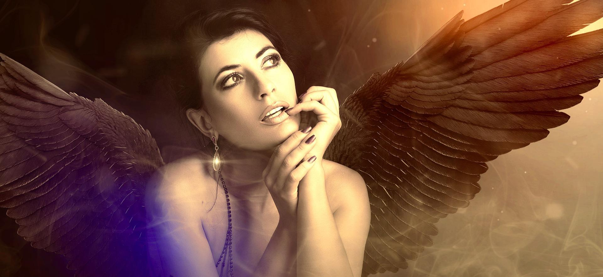 An angel that looks like a woman, with brown angelic wings, looks upward to her left. Her elbows rest on a surface and her chin in her hands. She looks pensive, sending angelic thoughts?