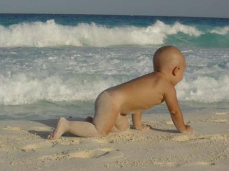 Beach baby in birthday suit