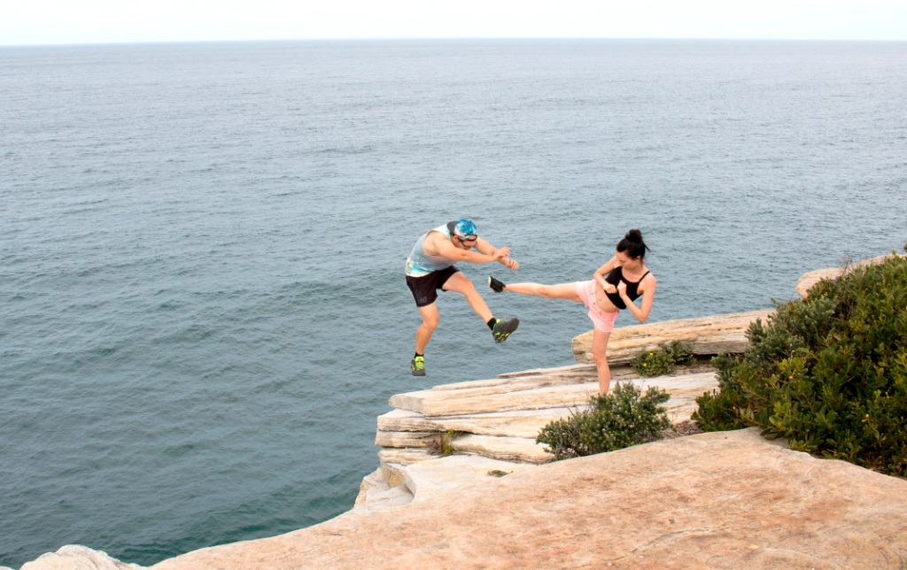 Woman kicks man off cliff