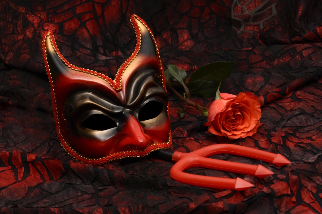 Devil mask, trident, rose