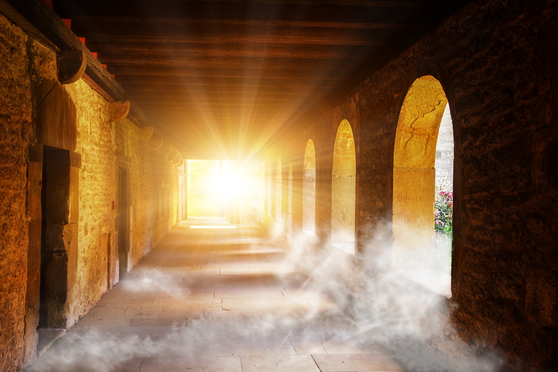 Powerful sun light shines through the cloister of a fortress