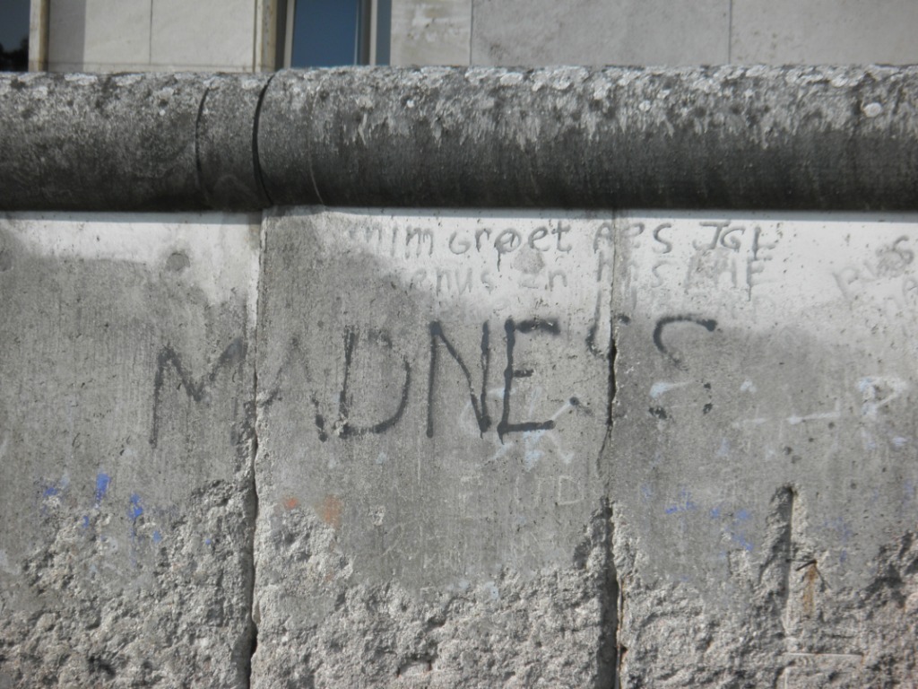 'Madness' scrawled on Berlin Wall