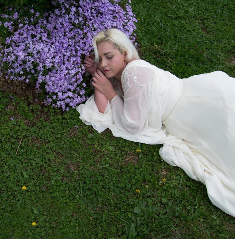 Woman asleep by flowers