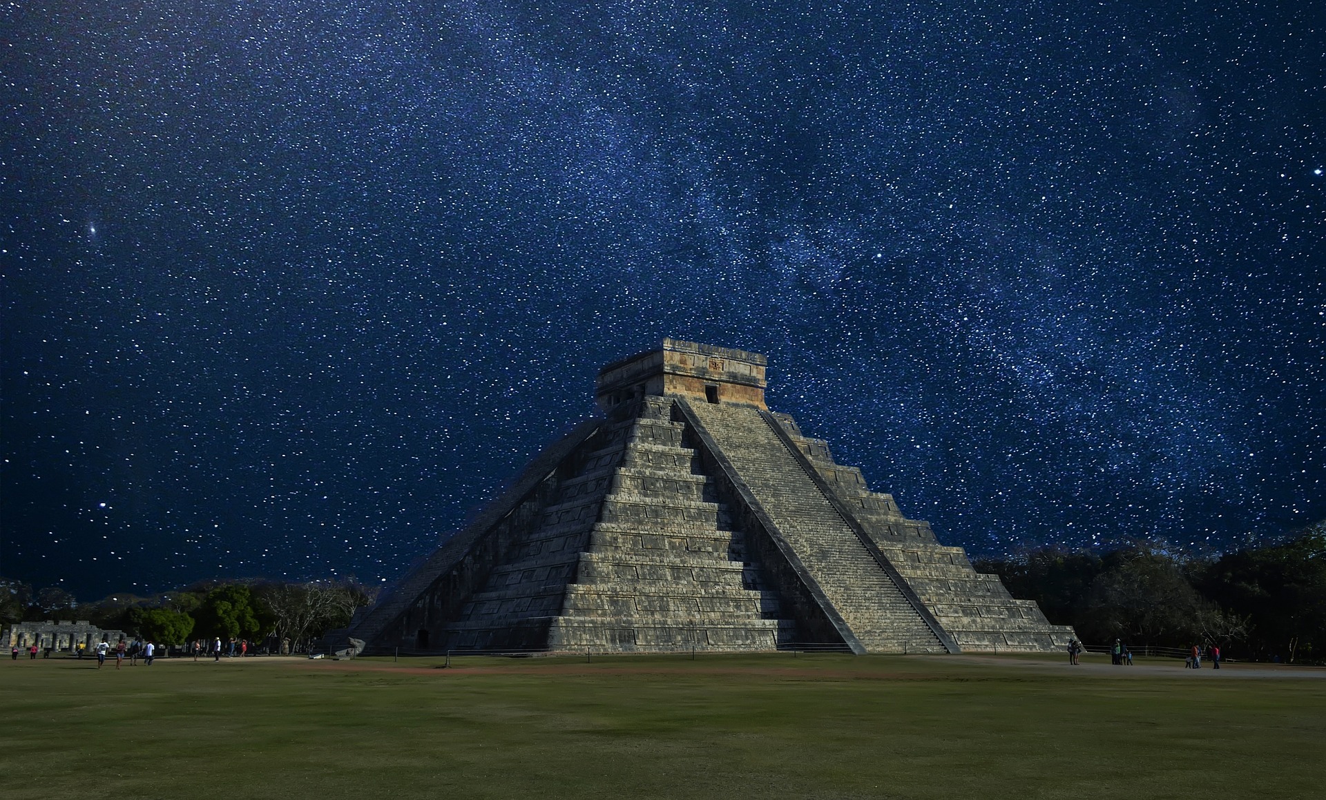 Chichen Itza ziggurat in Mexico is underneath a skyful of stars, the Milky Way