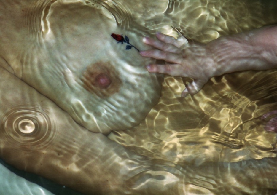 Child reaching for breastmilk
